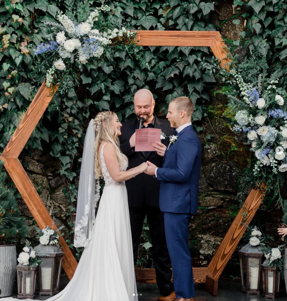 Outdoor courtyard wedding ceremony under a hexagon arch at Stone House — 10 minutes from Grass Valley