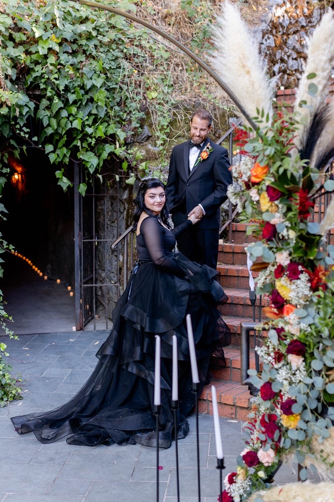 Styled wedding couple portrait at Stone House Nevada City — historic 1857 venue with original stonework as ceremony backdrop