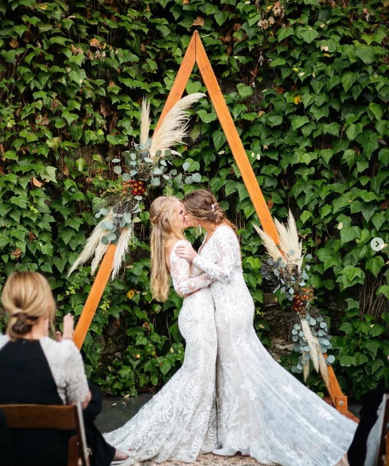 Outdoor wedding reception in The Courtyard at Stone House Nevada City — string-lit dinner under open sky
