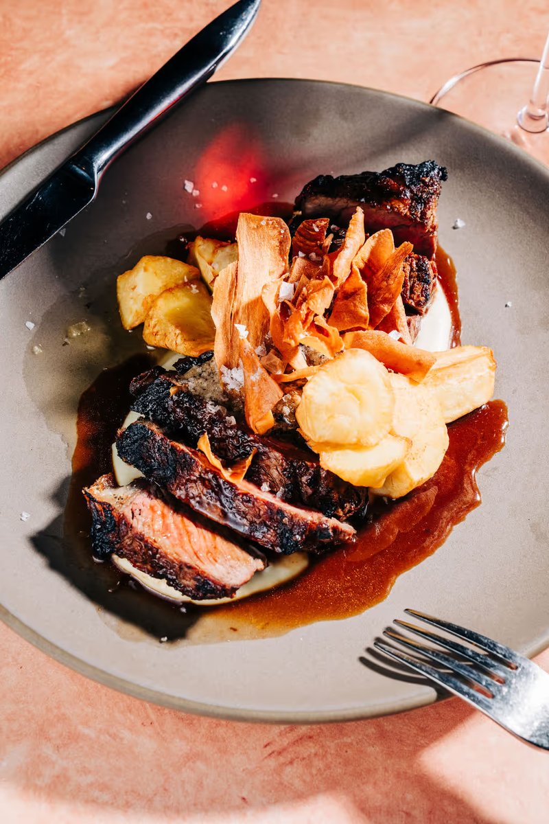 Signature dry-aged steak entrée plated for a private wedding dinner at Stone House Nevada City — chef-curated seasonal menu
