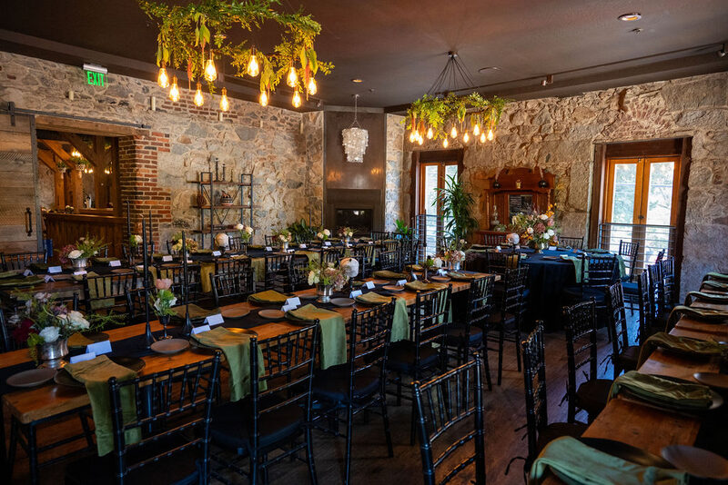 The Lounge at Stone House Nevada City — relaxed pre-ceremony lounge space with original 1857 stonework and modern seating