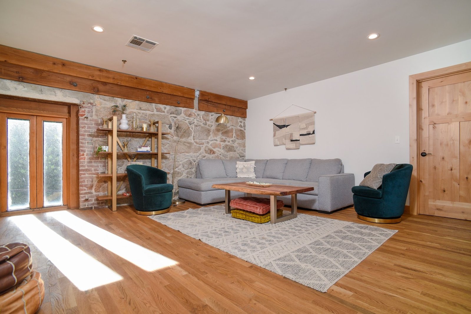 The Penthouse lounge at Stone House Nevada City — top-floor wedding party suite with city views and historic architecture