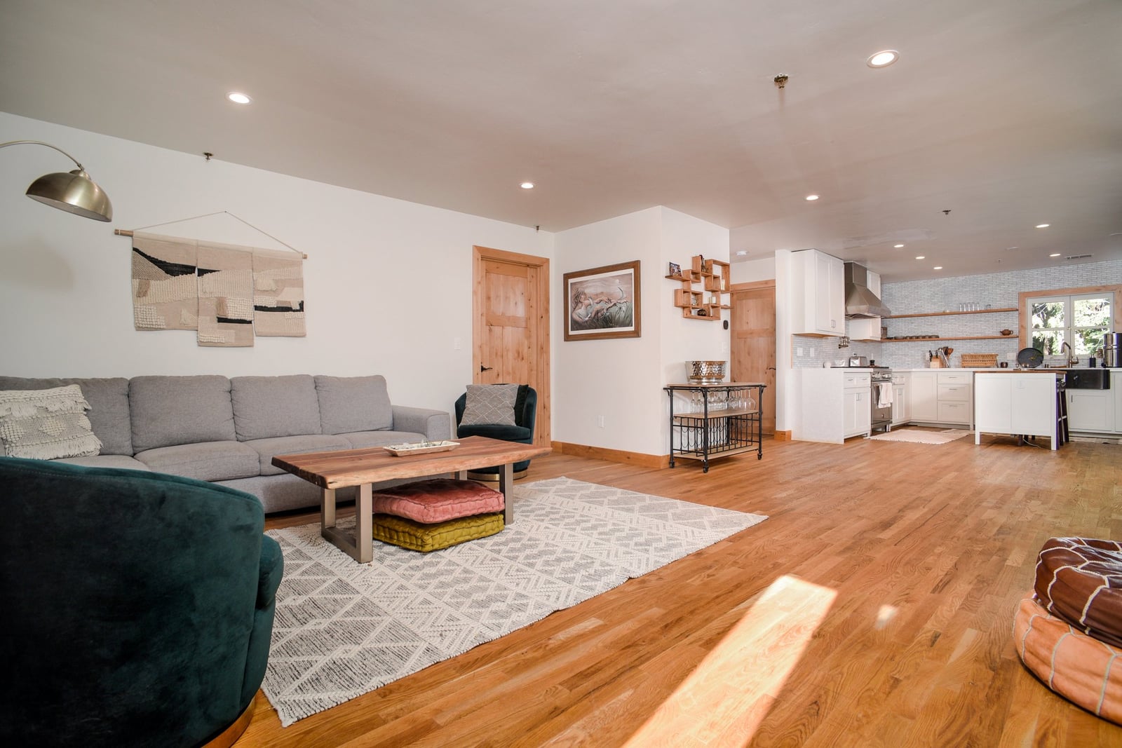 Living area of The Penthouse bridal suite at Stone House Nevada City — exposed brick and historic stonework