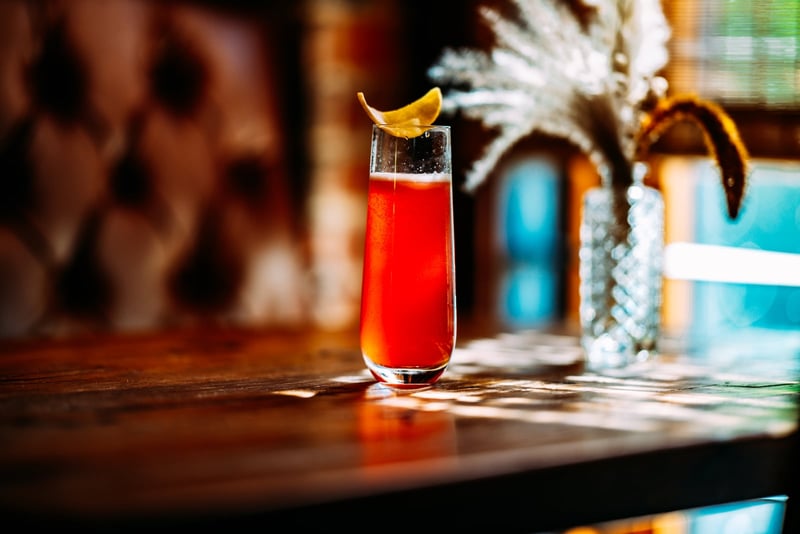 Red champagne signature cocktail at a Stone House Nevada City private event