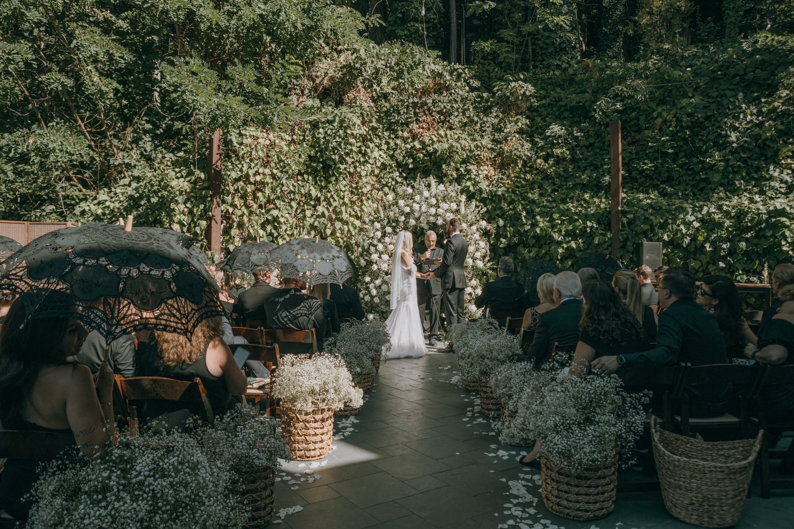 Wedding couple celebration moment at Stone House Nevada City — historic 1857 venue with original stonework as the romantic backdrop