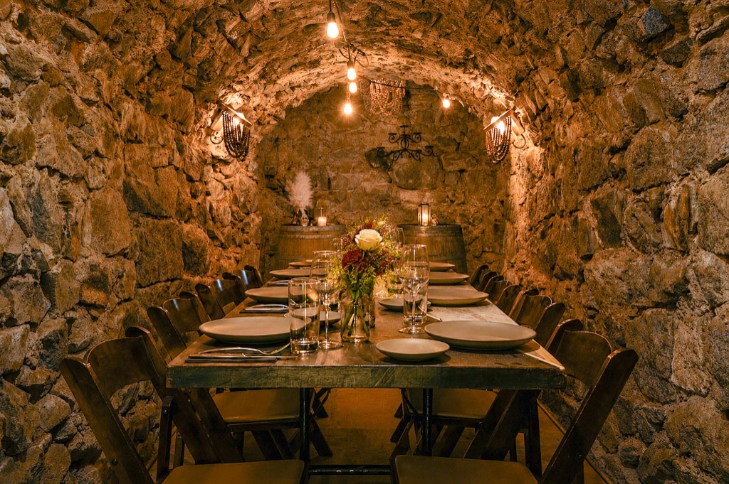 Private dining table set in The Cavern at Stone House Nevada City